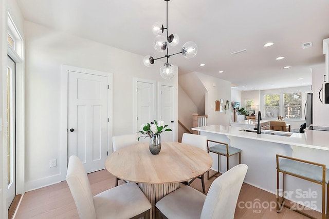 1223 E 16th St Unit 13, Charlotte, NC 28205 - dining space with light wood-style floors and recessed lighting