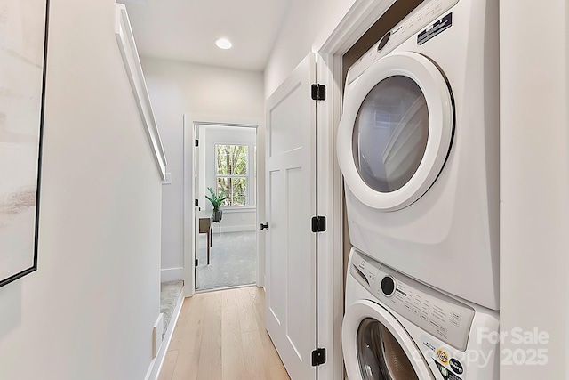 1223 E 16th St Unit 13, Charlotte, NC 28205 - laundry room with stacked washer and clothes dryer, light wood-type flooring, and recessed lighting