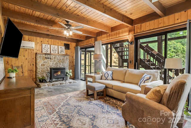 79 Creekside Ln, Spruce Pine, NC 28777 - living room featuring wood walls, a wall unit AC, a wood ceiling with exposed beams, and a ceiling fan