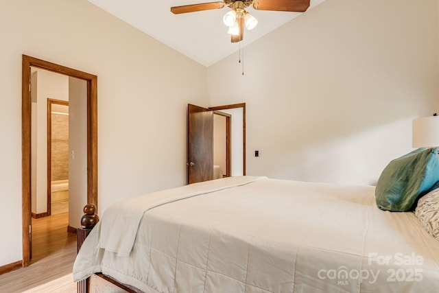 79 Creekside Ln, Spruce Pine, NC 28777 - bedroom with light wood finished floors, lofted ceiling, and a ceiling fan