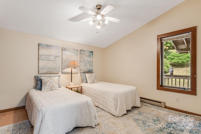 79 Creekside Ln, Spruce Pine, NC 28777 - bedroom with baseboard heating, vaulted ceiling, and ceiling fan