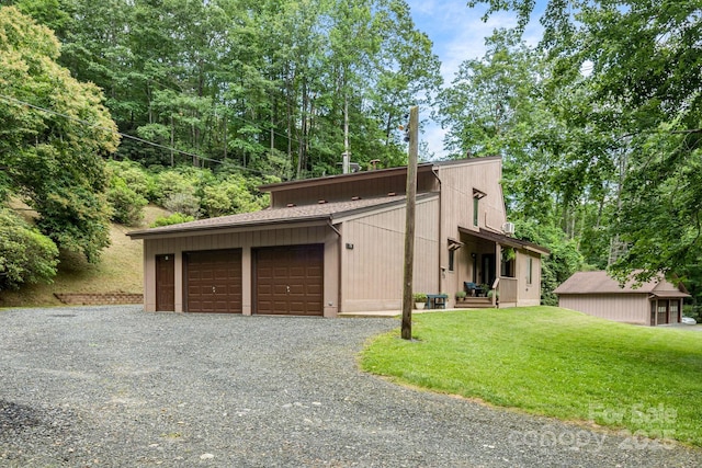 79 Creekside Ln, Spruce Pine, NC 28777 - view of front of home with a front lawn and a garage