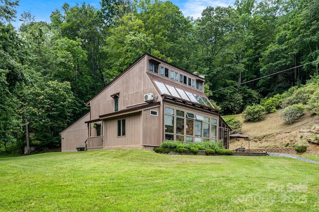 79 Creekside Ln, Spruce Pine, NC 28777 - rear view of house featuring a lawn