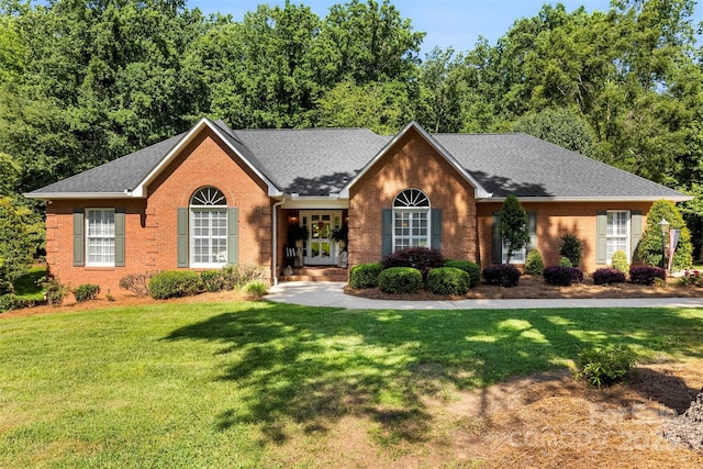 600 Queens Rd, Cherryville, NC 28021 - ranch-style home with brick siding, french doors, a front lawn, and a shingled roof