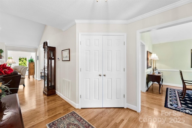600 Queens Rd, Cherryville, NC 28021 - hallway with light wood-style flooring, crown molding, and a textured ceiling
