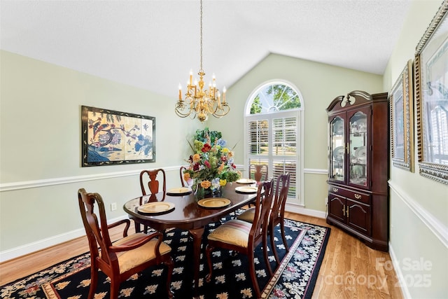 600 Queens Rd, Cherryville, NC 28021 - dining area featuring a chandelier, light wood-style floors, and vaulted ceiling