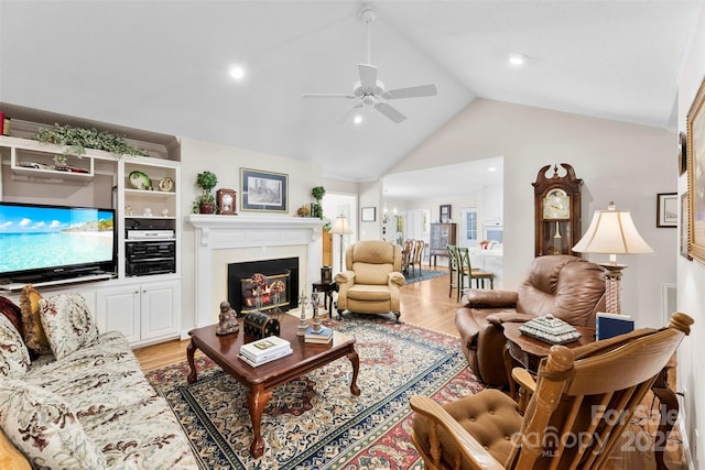 600 Queens Rd, Cherryville, NC 28021 - living area featuring a glass covered fireplace, a ceiling fan, light wood-type flooring, high vaulted ceiling, and recessed lighting