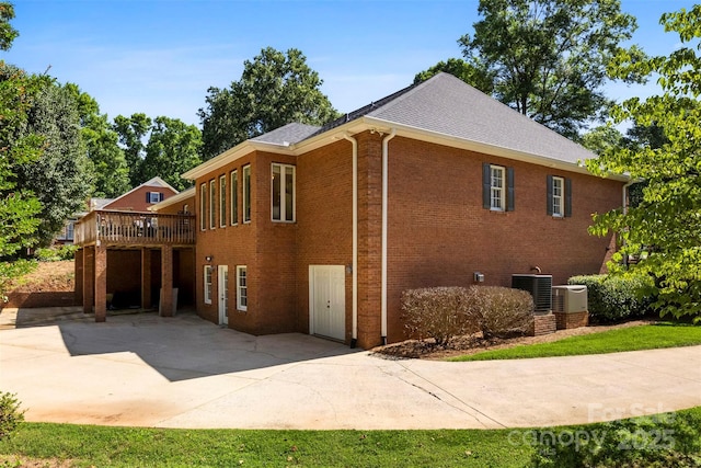 600 Queens Rd, Cherryville, NC 28021 - view of home's exterior featuring a deck, a patio, brick siding, and a shingled roof