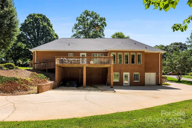 600 Queens Rd, Cherryville, NC 28021 - rear view of house with a patio, a deck, and brick siding