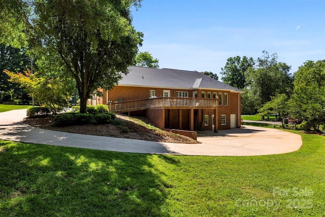600 Queens Rd, Cherryville, NC 28021 - back of property featuring driveway, a wooden deck, a yard, and an attached garage