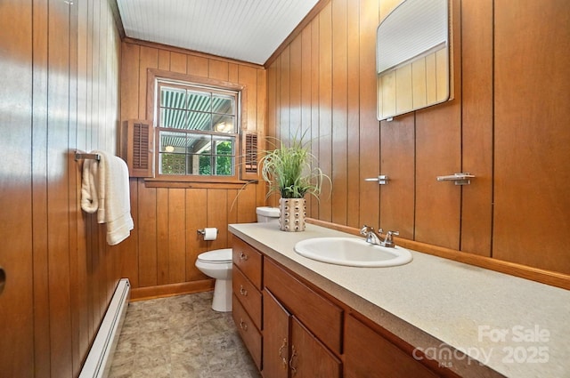 900 Nance St, Kannapolis, NC 28083 - bathroom featuring a baseboard heating unit, wood walls, and vanity