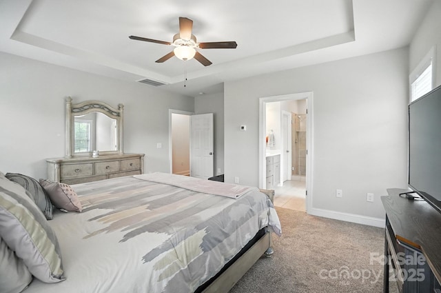 3256 Fairmead Dr, Concord, NC 28025 - bedroom featuring a raised ceiling, light carpet, ensuite bath, and a ceiling fan