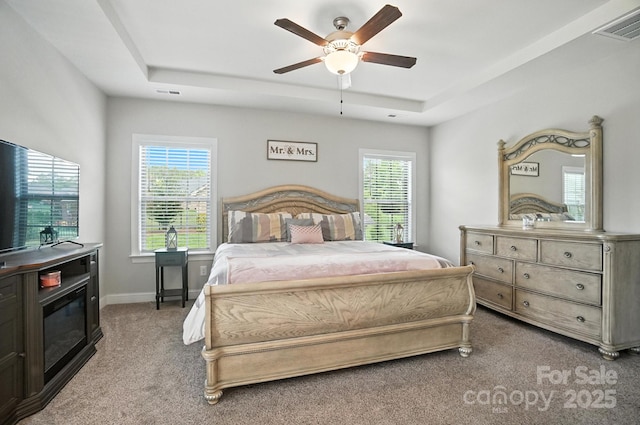 3256 Fairmead Dr, Concord, NC 28025 - bedroom with carpet, multiple windows, a tray ceiling, and ceiling fan