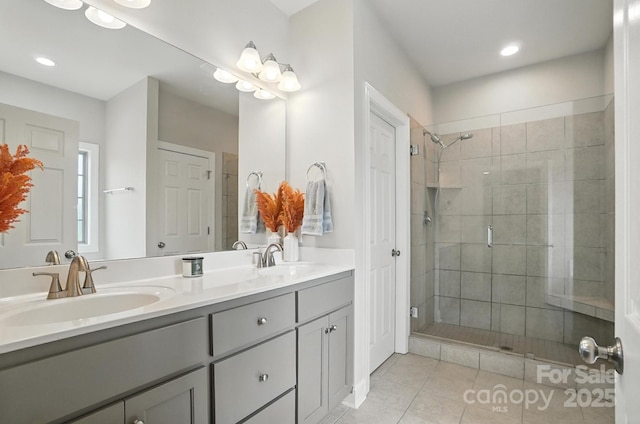 3256 Fairmead Dr, Concord, NC 28025 - bathroom with a stall shower, double vanity, tile patterned floors, and recessed lighting