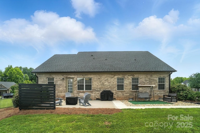 3256 Fairmead Dr, Concord, NC 28025 - back of house with a patio area, brick siding, and roof with shingles