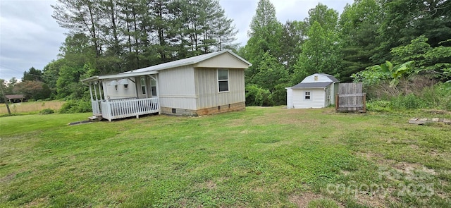 3682 Old Petra Mill Rd, Granite Falls, NC 28630 - rear view of property featuring crawl space, a yard, a storage shed, and view of scattered trees