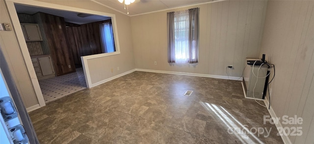 3682 Old Petra Mill Rd, Granite Falls, NC 28630 - empty room featuring wood walls, dark floors, and ceiling fan