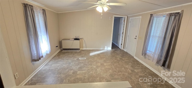 3682 Old Petra Mill Rd, Granite Falls, NC 28630 - empty room featuring ceiling fan, ornamental molding, lofted ceiling, and wooden walls