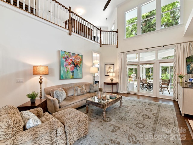 19205 Hidden Cove Ln, Cornelius, NC 28031 - living room with a towering ceiling, wood finished floors, a ceiling fan, and french doors