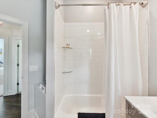19205 Hidden Cove Ln, Cornelius, NC 28031 - bathroom featuring shower / bathtub combination with curtain and vanity