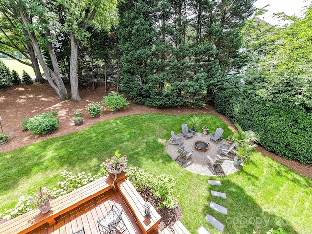 19205 Hidden Cove Ln, Cornelius, NC 28031 - view of grassy yard with a fire pit, a patio, and a deck