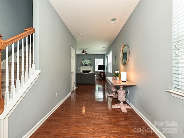 3009 Canopy Dr, Indian Trail, NC 28079 - hallway featuring wood finished floors and stairs