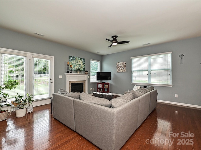 3009 Canopy Dr, Indian Trail, NC 28079 - living area with a glass covered fireplace, plenty of natural light, and dark wood finished floors