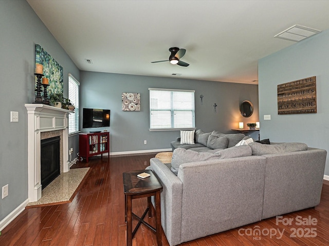 3009 Canopy Dr, Indian Trail, NC 28079 - living area with a ceiling fan, dark wood-style flooring, and a fireplace