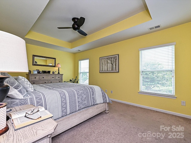3009 Canopy Dr, Indian Trail, NC 28079 - bedroom featuring a raised ceiling, carpet flooring, and ceiling fan