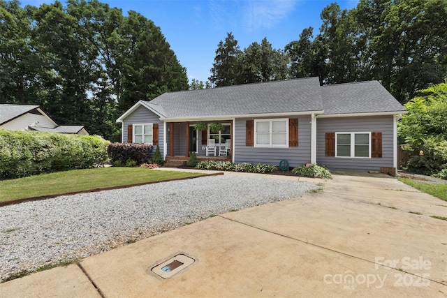 1507 Breckenwood Dr, Rock Hill, SC 29732 - ranch-style house with a porch, driveway, a shingled roof, and a front yard