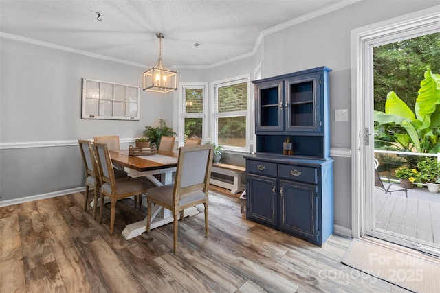1507 Breckenwood Dr, Rock Hill, SC 29732 - dining space with light wood-type flooring, a chandelier, and crown molding