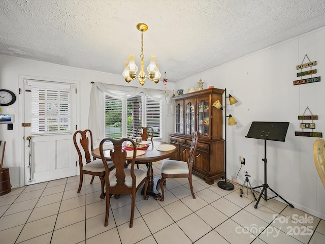 3471 Greentree Acres Rd, Valdese, NC 28690 - dining room with a chandelier, a textured ceiling, and light tile patterned floors