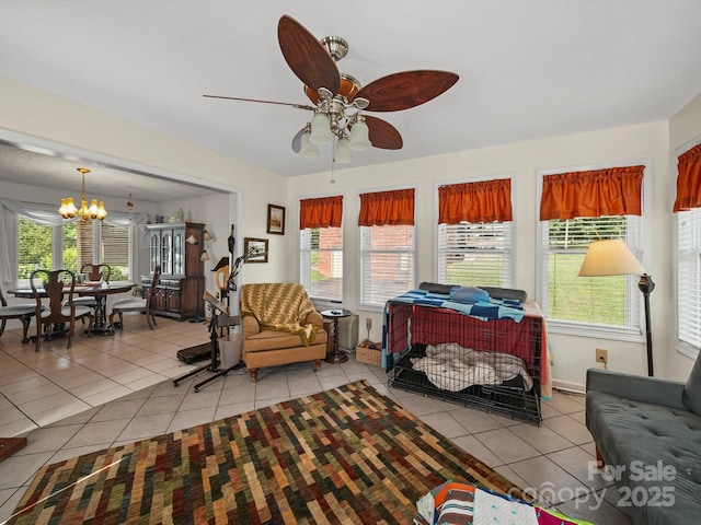 3471 Greentree Acres Rd, Valdese, NC 28690 - living room featuring light tile patterned flooring, a chandelier, ceiling fan, and plenty of natural light