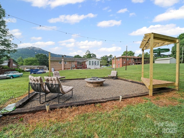 3471 Greentree Acres Rd, Valdese, NC 28690 - view of grassy yard with a fire pit and a mountain view