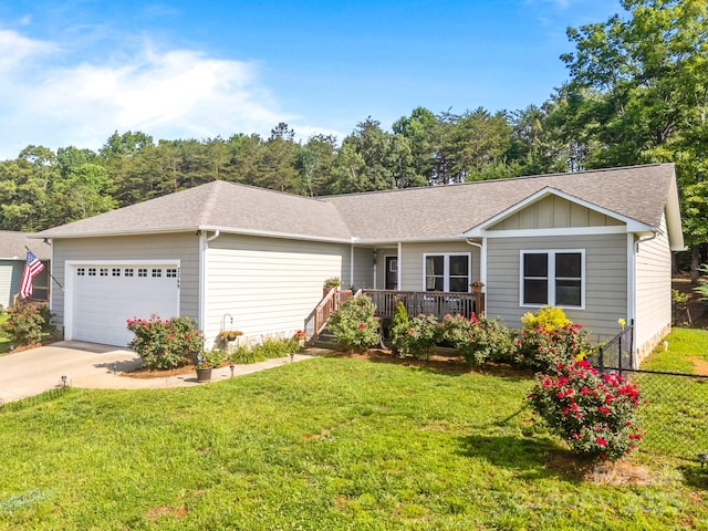 2369 Saratoga Run, Morganton, NC 28655 - ranch-style home with an attached garage, driveway, roof with shingles, board and batten siding, and a wooden deck