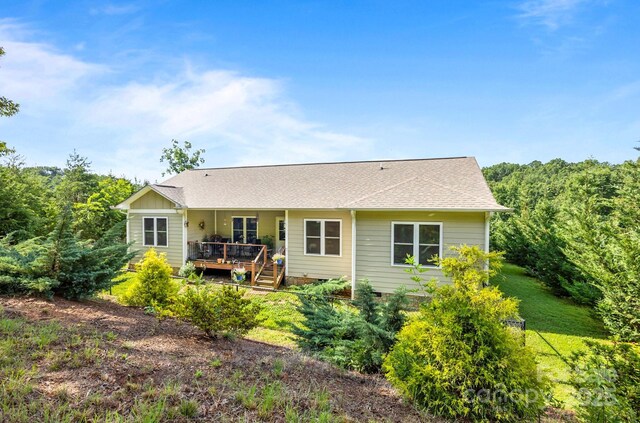 2369 Saratoga Run, Morganton, NC 28655 - back of property with a deck, roof with shingles, and a yard