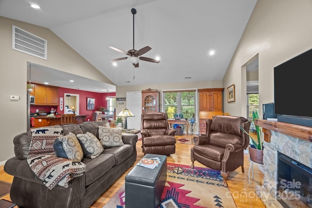2369 Saratoga Run, Morganton, NC 28655 - living area with light wood-style floors, a ceiling fan, a fireplace, high vaulted ceiling, and recessed lighting