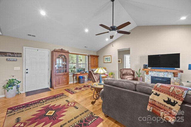 2369 Saratoga Run, Morganton, NC 28655 - living area with ceiling fan, wood finished floors, a stone fireplace, recessed lighting, and high vaulted ceiling