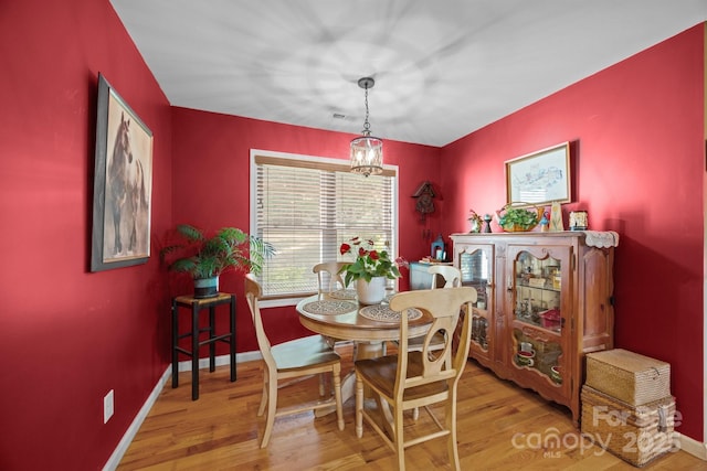 2369 Saratoga Run, Morganton, NC 28655 - dining area with wood finished floors and a chandelier