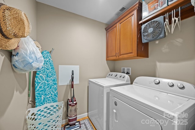 2369 Saratoga Run, Morganton, NC 28655 - laundry room with washing machine and dryer, cabinet space, and light wood finished floors
