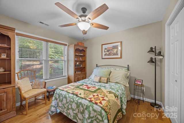 2369 Saratoga Run, Morganton, NC 28655 - bedroom with light wood-type flooring, a closet, and ceiling fan
