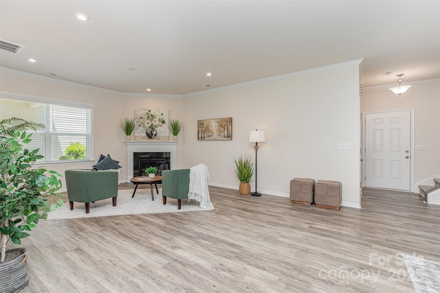 1514 Starmount Cove Ln, Charlotte, NC 28210 - sitting room featuring ornamental molding, light wood finished floors, a premium fireplace, stairway, and recessed lighting