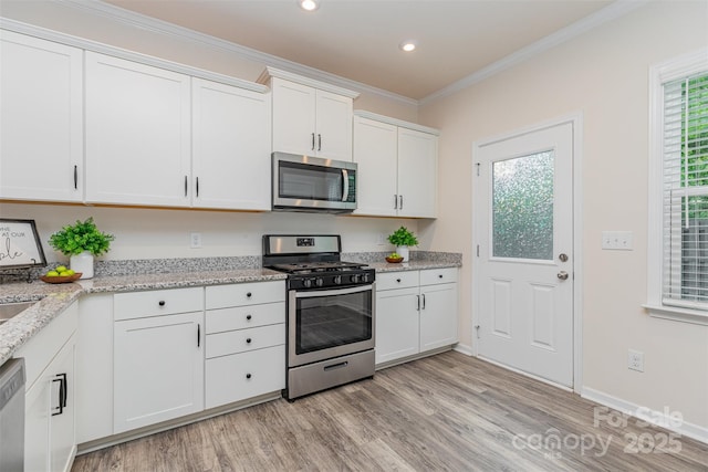 1514 Starmount Cove Ln, Charlotte, NC 28210 - kitchen with stainless steel appliances, light wood-style floors, white cabinets, light stone countertops, and recessed lighting