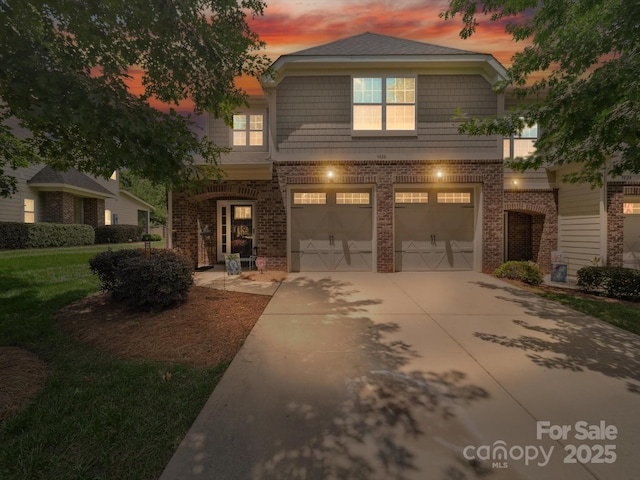 9428 Carneros Creek Rd, Charlotte, NC 28214 - view of front of property with brick siding, driveway, a garage, and a front lawn