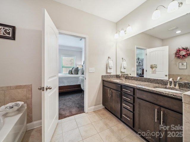 9428 Carneros Creek Rd, Charlotte, NC 28214 - ensuite bathroom featuring double vanity, a garden tub, and tile patterned flooring