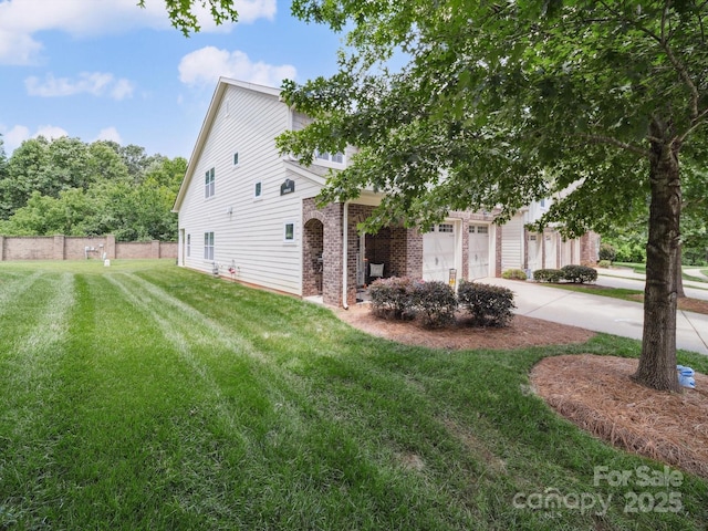9428 Carneros Creek Rd, Charlotte, NC 28214 - view of home's exterior with brick siding and concrete driveway