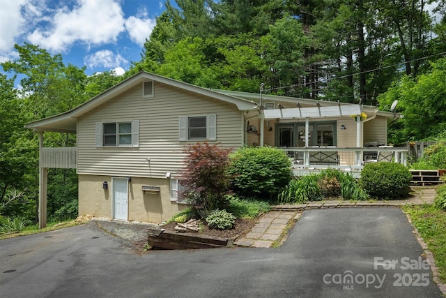 665 Will Robbins Ln, Newland, NC 28657 - view of front of home featuring covered porch and view of scattered trees