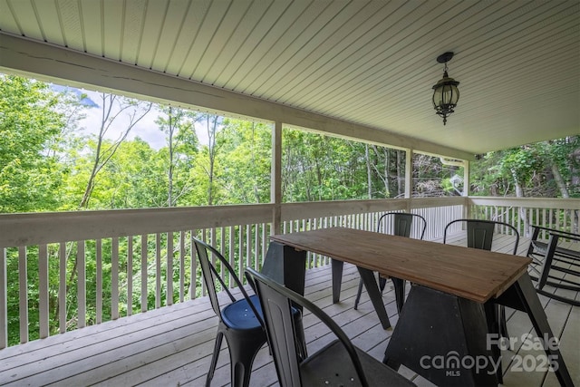 665 Will Robbins Ln, Newland, NC 28657 - wooden terrace featuring outdoor dining area