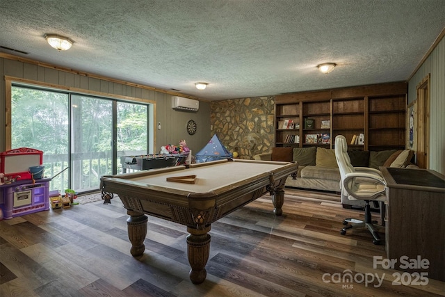 665 Will Robbins Ln, Newland, NC 28657 - recreation room with billiards table, a wall unit AC, a textured ceiling, wood finished floors, and wood walls