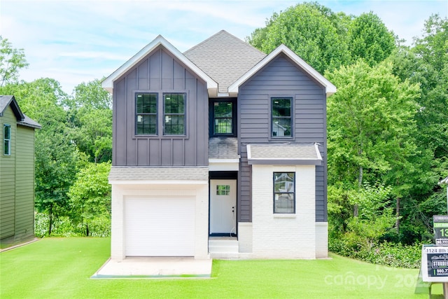 1124 8th St, Statesville, NC 28677 - view of front of property featuring board and batten siding, roof with shingles, and a front yard